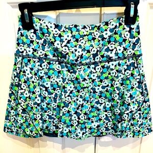 Athleta tennis/golf skirt. Size XS. Blue and green flower print